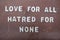 Love for all, hatred for none, peace quote phrase composed with wooden letters