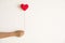 Love background, hand holding red heart knitting shape