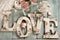 Love background with vintage style letters and roses