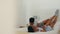 Love, black couple and fun while kiss together in bedroom to relax, talk and cuddle romantic, intimate and playful