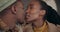 Love, cafe or black couple kiss on date speaking of anniversary celebration on holiday vacation. Celebrate, African