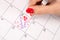 Love in the Calendar: Young Female Hand Drawing Hearts and Words for Valentine\\\'s Day