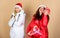 They love christmas. family vacation. women in down jacket. girls santa claus hat. christmas fashion. fun and gifts