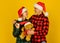 We love christmas. Loving couple yellow background. Christmas time. Couple in love with teddy bear soft toy enjoy