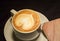 Love coffee,A cup of latte art with heart pattern in a white cup.Indoor cafe