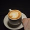 Love coffee,A cup of latte art with heart pattern in a white cup.Indoor cafe