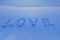 love. cold love. the inscription the letter text love on the snow
