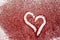 Love concept background with heart on red glittery surface, valentines day and love celebration