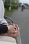 love concept - close up of engaged couple holding hands with ring