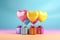 Love concept colorful heart shaped balloons flying with gift boxes on pink background