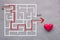 Love concept maze drawing with red heart