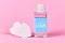 Love concept with plastic bottle filled with liquid and made up label saying `45ml concentrated LOVE` on pink background