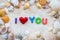 Love concept with sea shell frame and word i love you