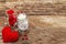 Love concept for Valentines day or mothers day. Red felt heart, glass jar, roses, ribbons. Old wooden boards background