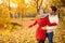 Love couple in autumn walking in park