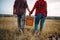 Love couple with basket, picnic in summer field