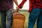 Love couple with basket, picnic in summer field