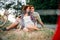 Love couple with vintage bikes sitting on grass