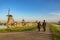 Love couple walking with Dutch Windmill at Kinderdijk Village