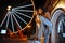 Love couple walking in night amusement park