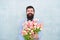 Love date with flowers. Happy Birthday. bride groom at wedding party. bearded man in bow tie with tulip flowers. spring