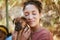 Love, dog and animal shelter with a black woman hugging a foster pet while at a shelter to adopt a rescue animal