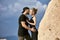 In love Eastern couple in mountains of Cappadocia hugs and kisses. Love and emotions loving couple vacationing in Turkey. Closeup