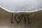 Love end sand writing