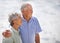 They love enjoying lifes little pleasures together. an elderly couple on the beach.