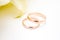 love, family, celebration, ceremony concept -wedding symbols two golden rings with callas white flowers