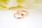 love, family, celebration, ceremony concept -wedding symbols two golden rings with callas white flowers