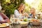 Love and food are meant to be shared. a family eating lunch together outdoors.