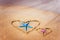 Love formula is drawn on the sand by the sea.Two starfishes Valentine`s Day