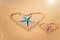 Love formula is drawn on the sand by the sea.Two starfishes Valentine`s Day