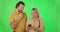 Love, green screen and couple with a smartphone, typing and social media against a studio background. Partners, man and
