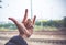 Love hand sign with blurred train track at background,Love travel concept