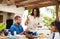 Love, happiness and good food. Shot of a beautiful young woman dishing up salad on her husbands plate while enjoying a