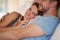 Love, happy and portrait of couple on bed for bonding, loving relationship and relaxing together in home. Marriage