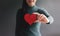 Love, Health Care, Donation and Charity Concept. Close up of Smiling Volunteer Woman Holding a Heart Shape Paper