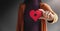 Love, Health Care, Donation and Charity Concept. Close up of Volunteer Woman Holding a Heart Shape with Cross Sign Paper.