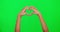 Love, heart and hand sign on green screen for support, shape emoji or charity. Hands of model person show icon or symbol