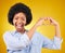 Love, heart hands and portrait of black woman, smile and kindness isolated on yellow background. Motivation, support and