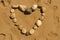 Love heart from pebbles on a beach