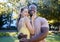 Love, interracial and couple hug in park, bonding and happiness for romance, wellness and quality time together