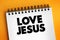 Love Jesus text on notepad, concept background