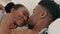 Love, kiss and bedroom intimacy with black couple being playful and affectionate while laughing and touching at home