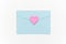 Love Letter. Blue closed envelope and pink heart with text LOVE on white background. Top view Flat lay Template for your