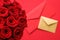 Love letter and flower delivery service on Valentines Day, luxury bouquet of red roses and card envelopes on red background
