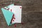 Love letter with red hearts. Blank template with place for text on postcard. Green envelope on old wooden background. mock-up