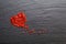 Love life Background Blurred red fake crystal on black stone plate